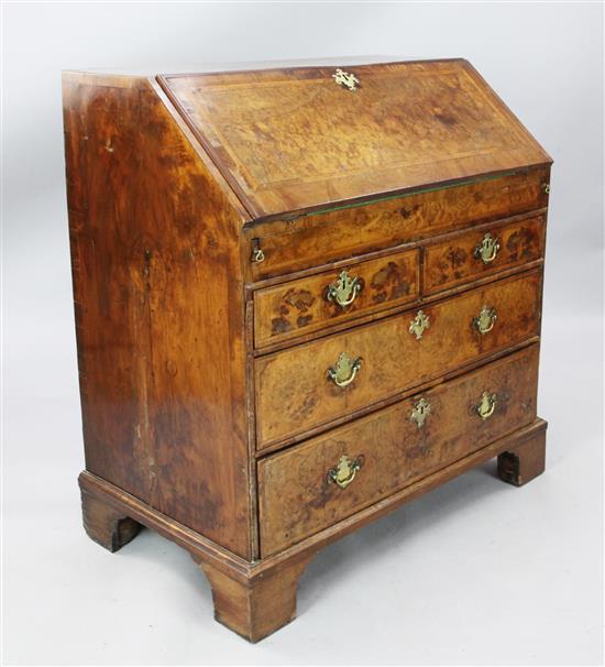 An early 18th century featherbanded walnut bureau, W.3ft 3in. D.1ft 11in. H.3ft 6in.